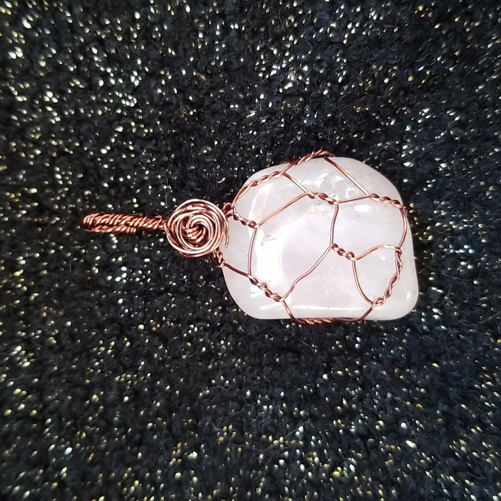 rose quartz wrapped in antique copper color coated copper wire